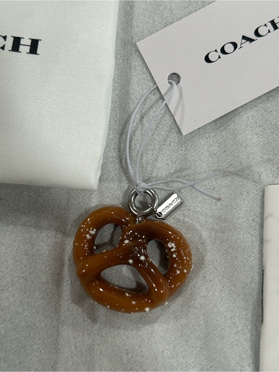 Coach Handbags - Coach Pretzel Charm with micro hang tag, care booklet, tag & Dust Bag. NWT